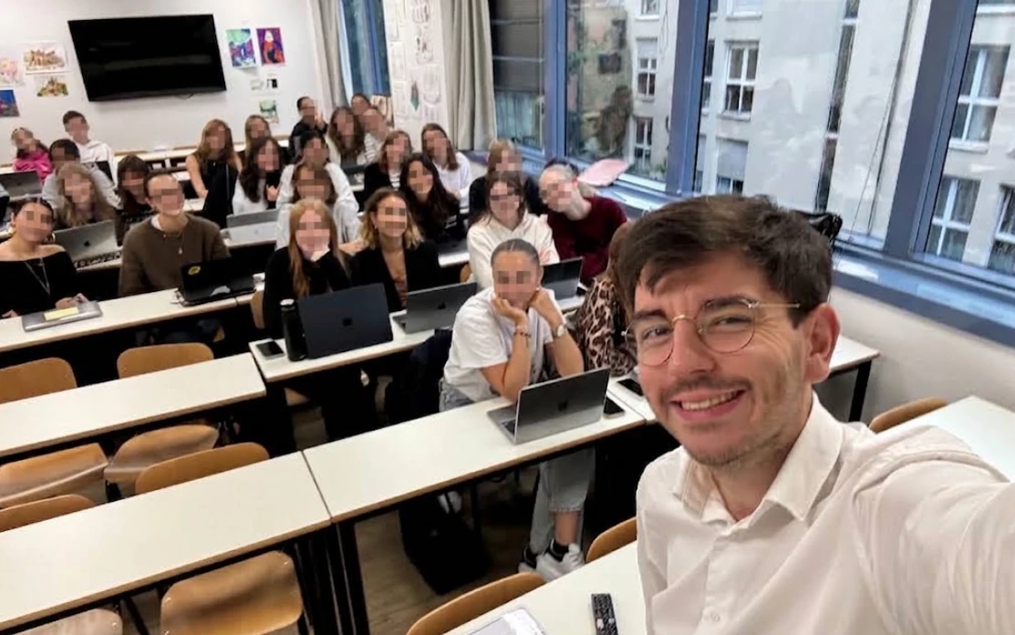 Second group of students in class, faces blurred